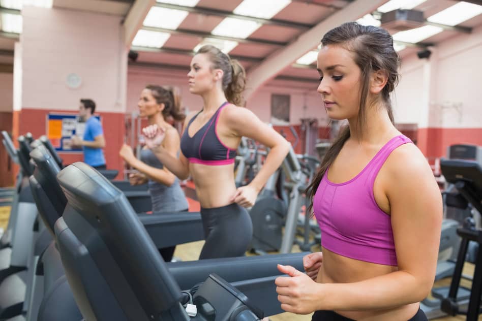 People exercising in the gym on treadmills