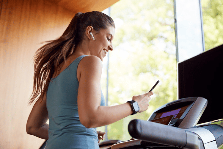 Woman Enhancing her treadmill workout for weight loss