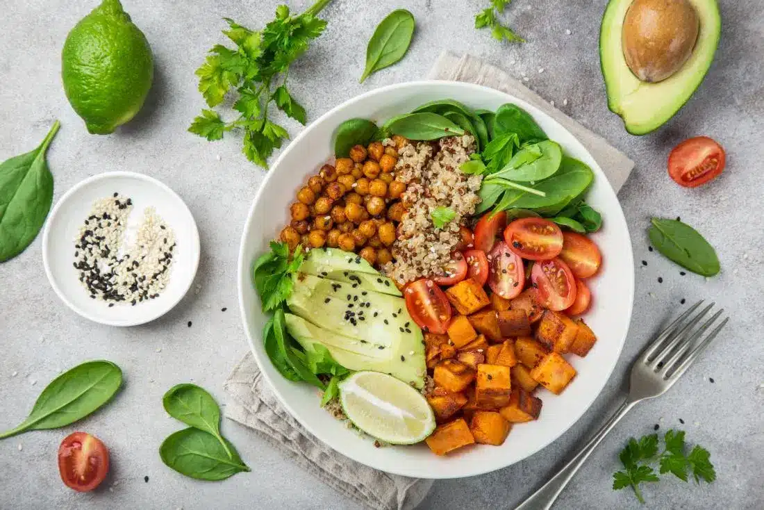 Vegan-meal-with-chickpeas-quinoa-sweet-potato-avocado-lime-and-high-fiber-vegetables-and-legumes-for-pcos-diet